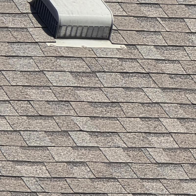 Roof shingles and ventilation exhaust inspection on roof