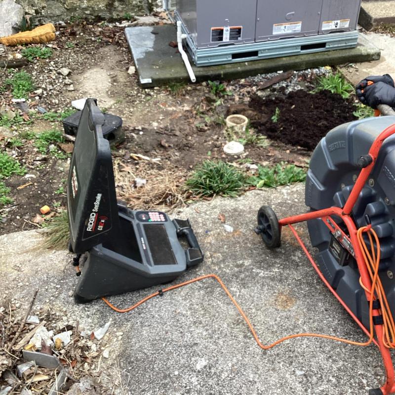 Sewer camera inspection system setup on concrete driveway