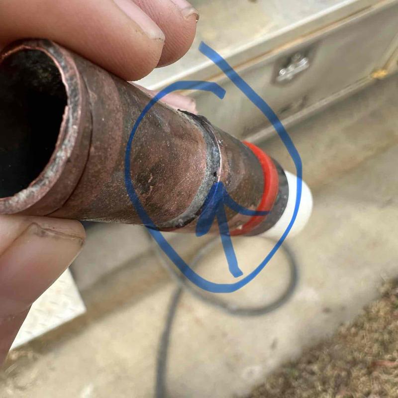 Copper pipe with damaged section marked by blue arrow Copper pipe with damaged section marked by blue arrow