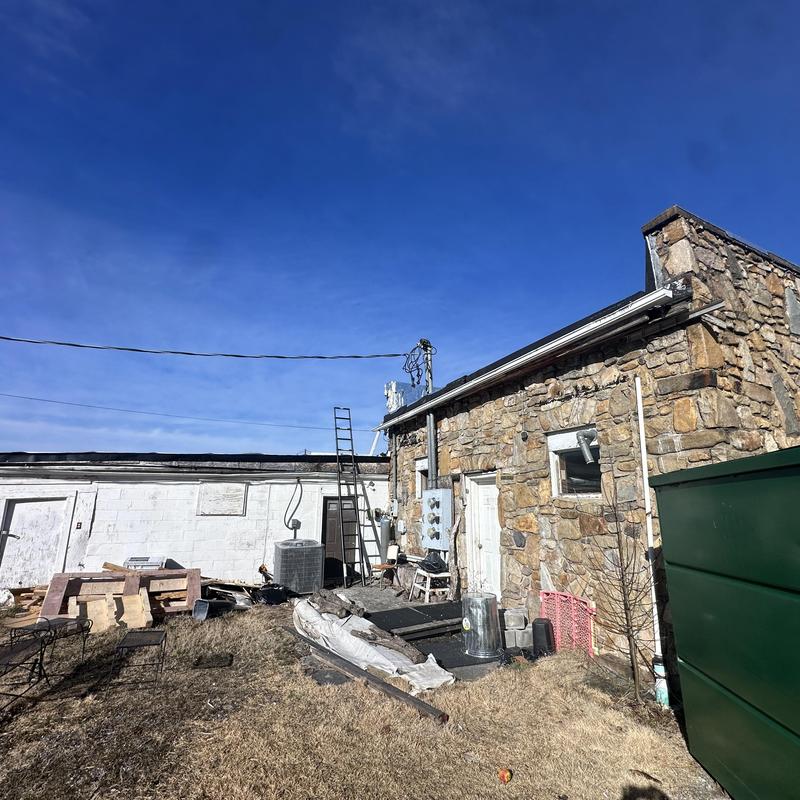 Flat roof and stone building exterior in Blountville, TN
