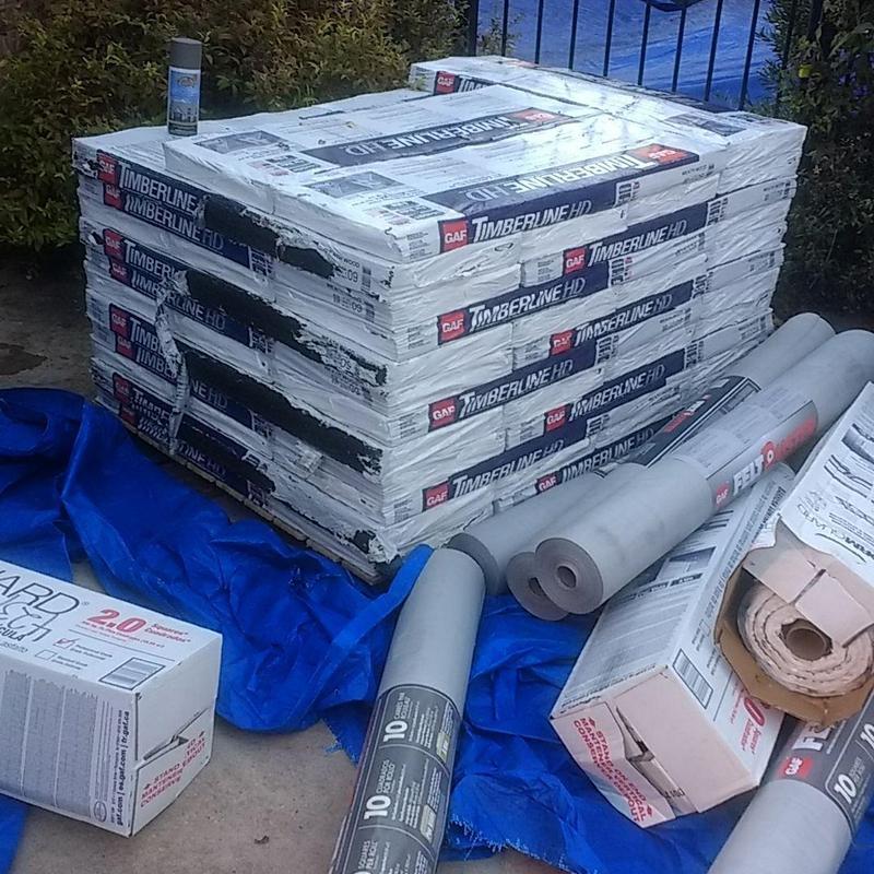 GAF Timberline HD shingles and roofing materials stacked