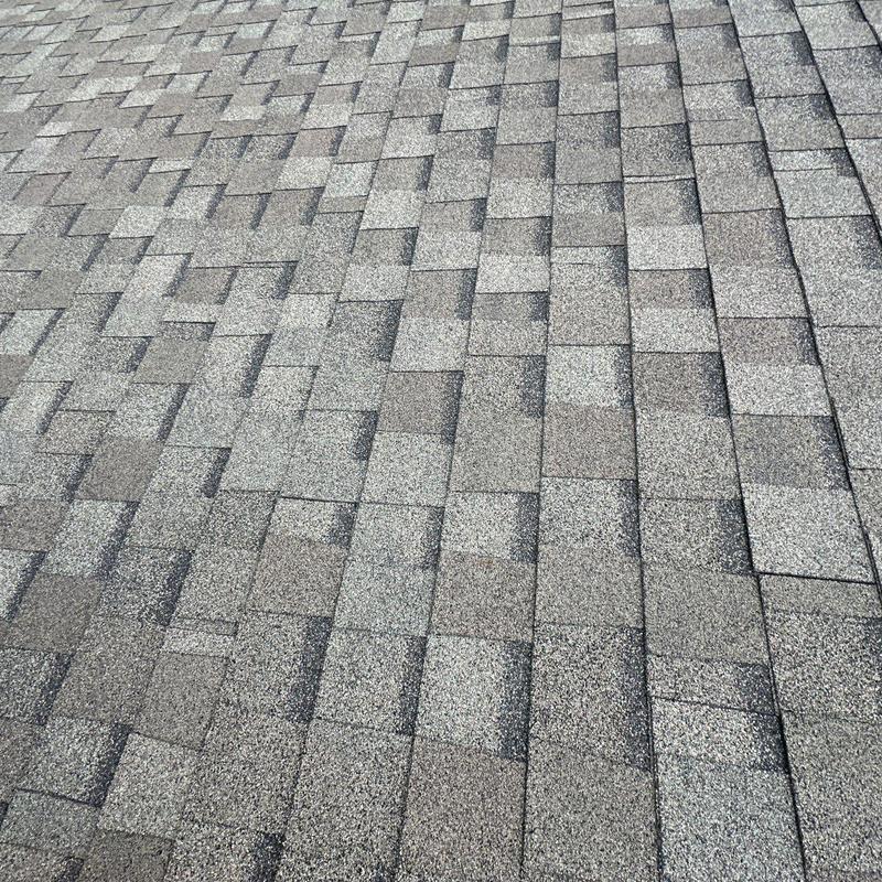Asphalt shingle roof with hail damage inspection