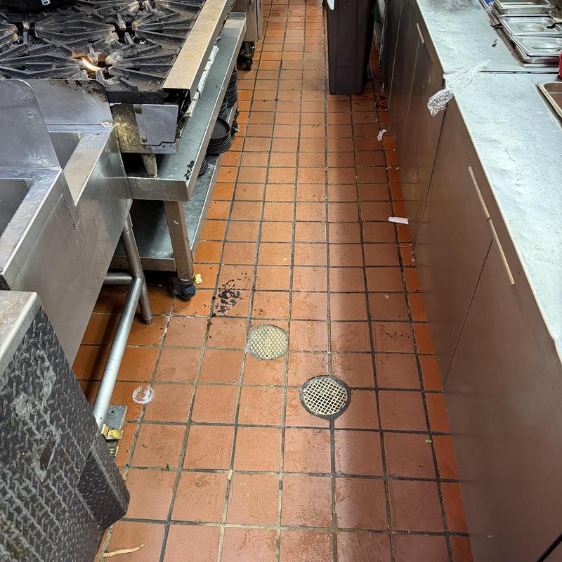 Kitchen floor drains in commercial kitchen walkway