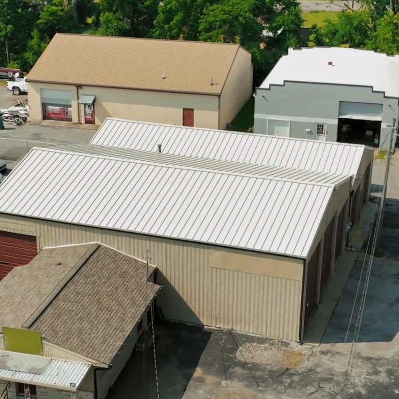 Metal roof hail damage inspection on commercial building