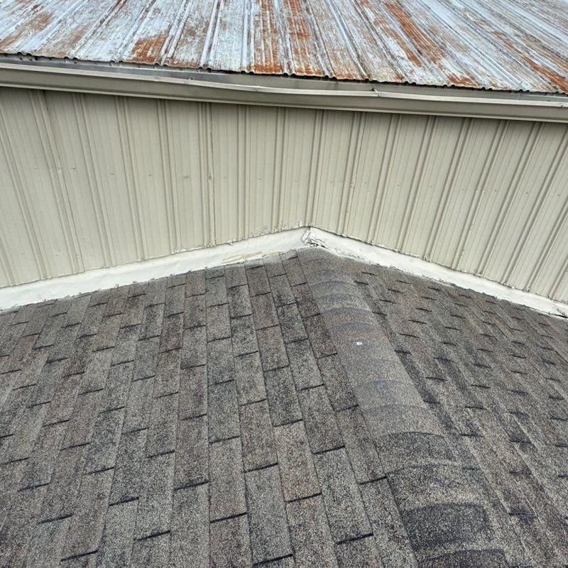Asphalt shingle roof and metal flashing with hail damage