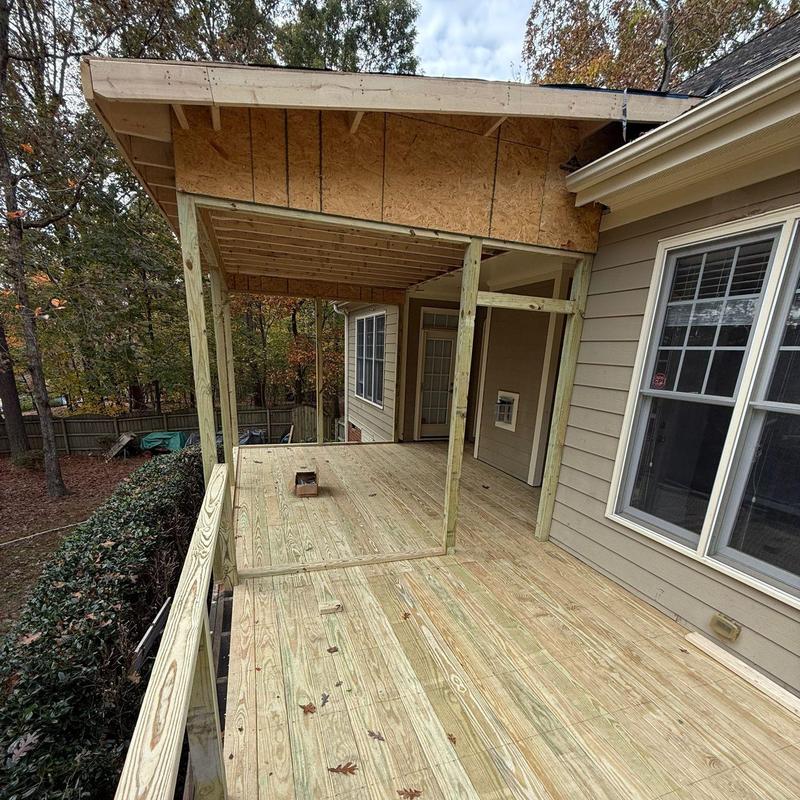 Wood deck and screened porch framing in progress Wood deck and screened porch framing in progress