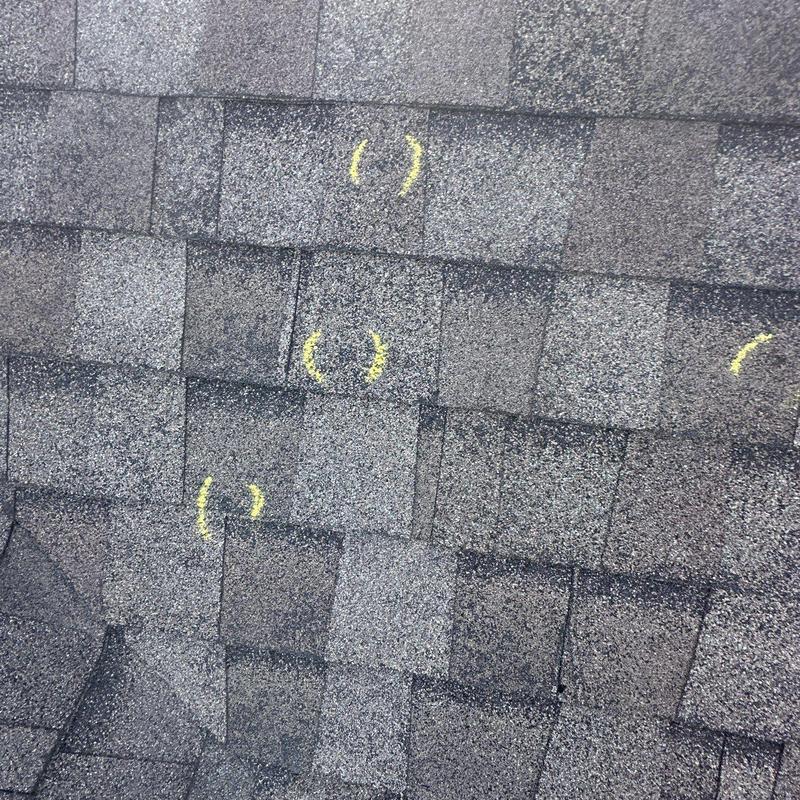 Asphalt shingles with hail damage markings