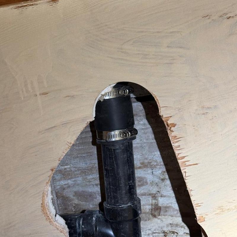 ABS waste piping connection through wall with clamps