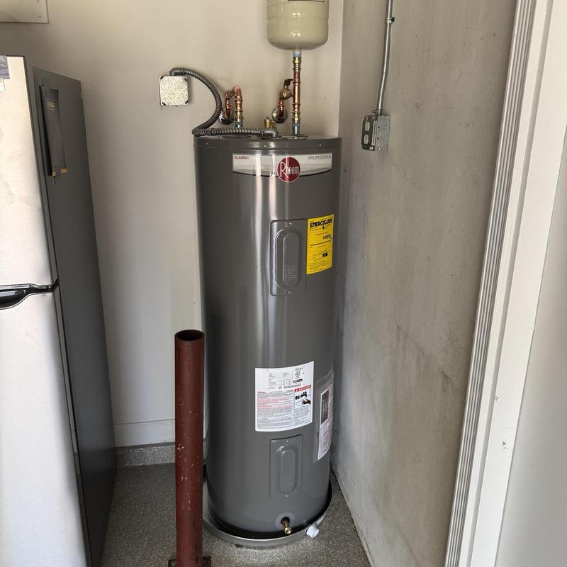 Rheem 50-gallon water heater installation in utility room