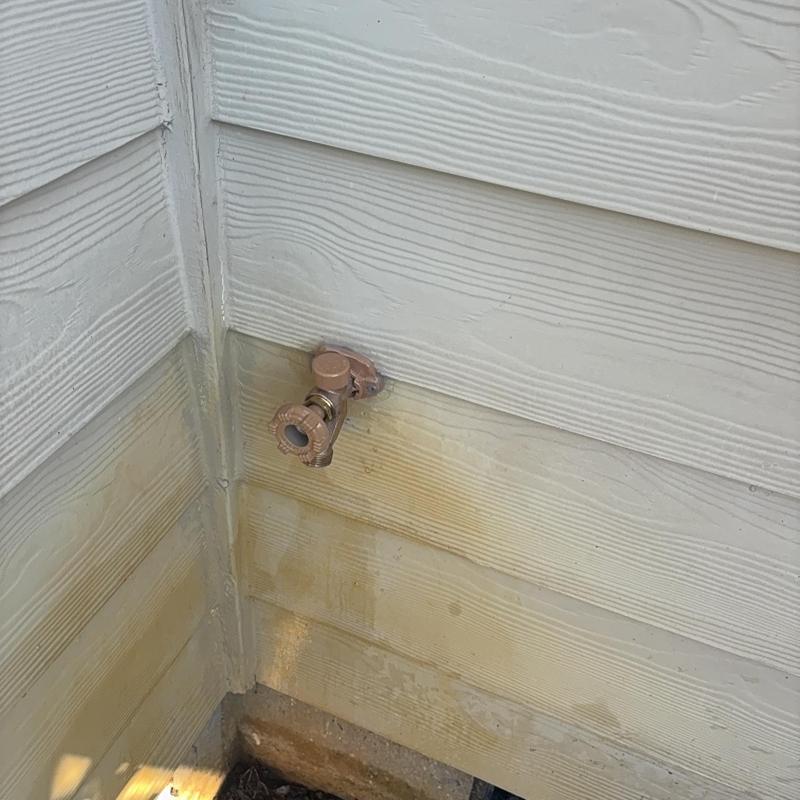 Frost-free exterior hose bib installed on siding wall