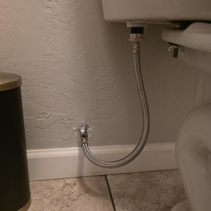 Toilet supply line with metal ends installed