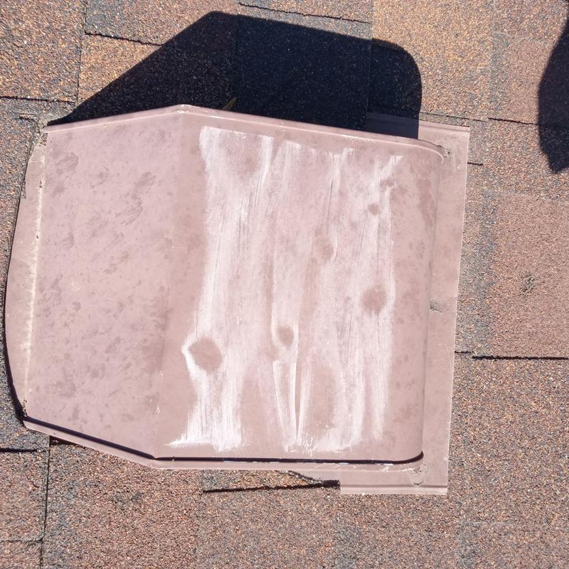 Roof vent metal cover with visible hail damage Roof vent metal cover with visible hail damage