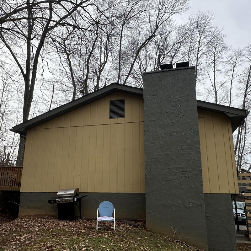 Roof shingles on residential home exterior wall