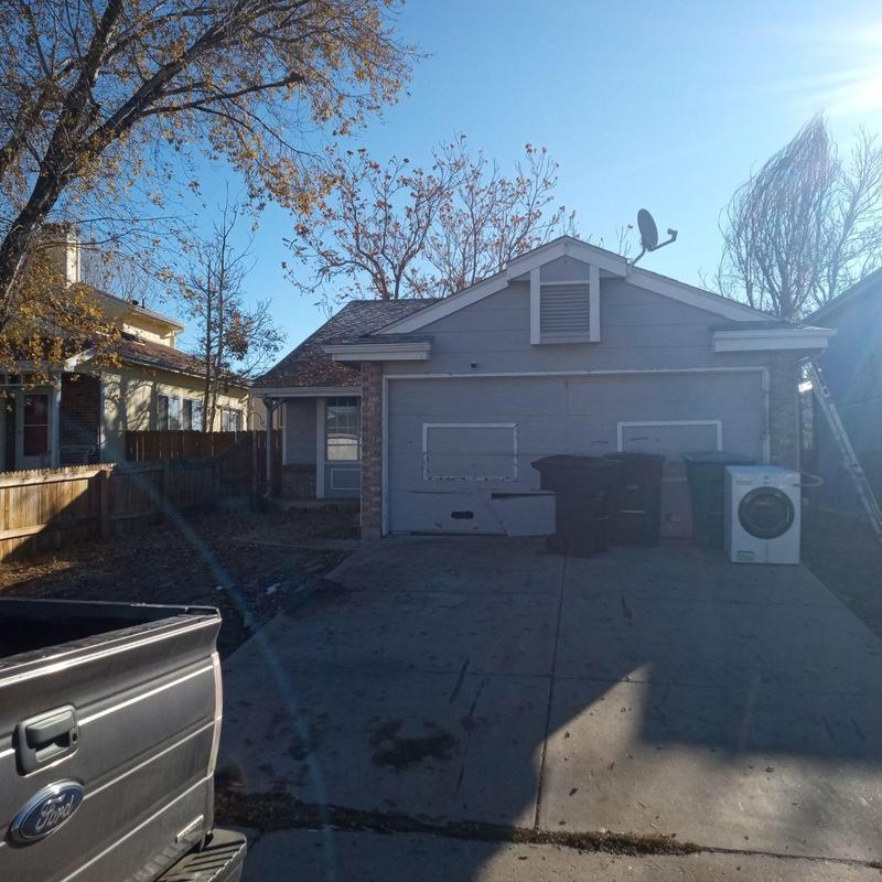 Residential garage door with exterior wall and driveway Residential garage door with exterior wall and driveway