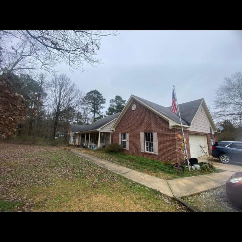 Asphalt shingle roof inspection on brick house