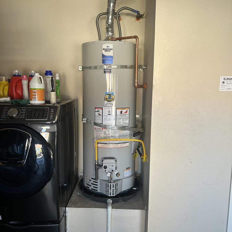 Bradford White water heater with new gas line and catch pan