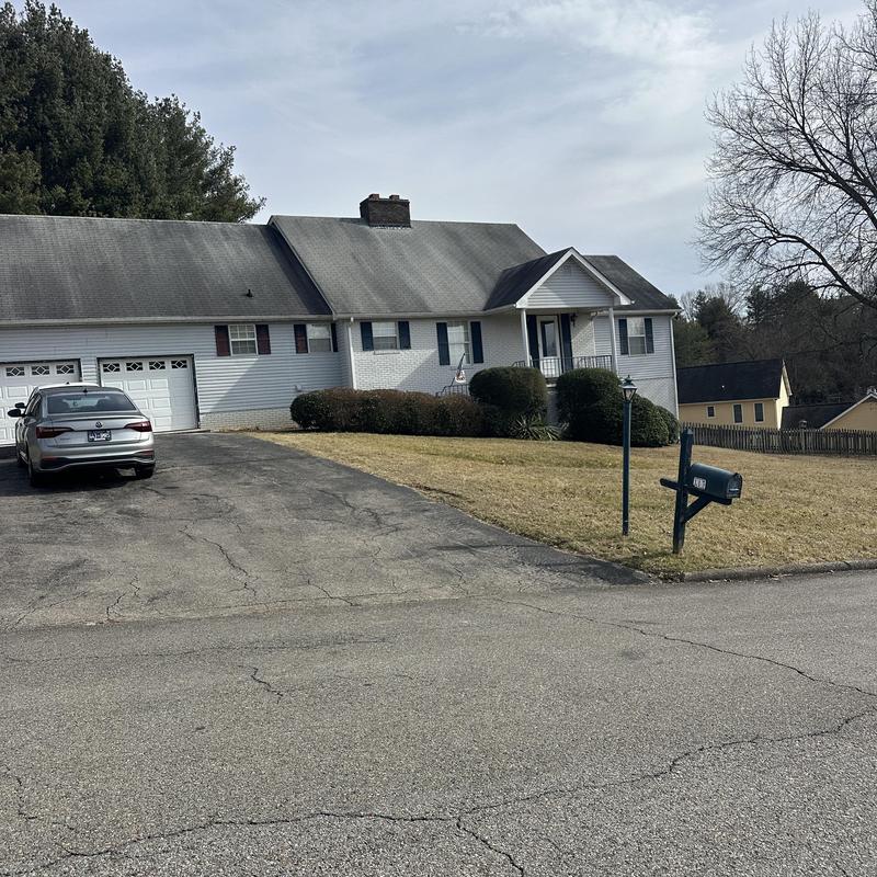 Shingle roof with discoloration on residential home