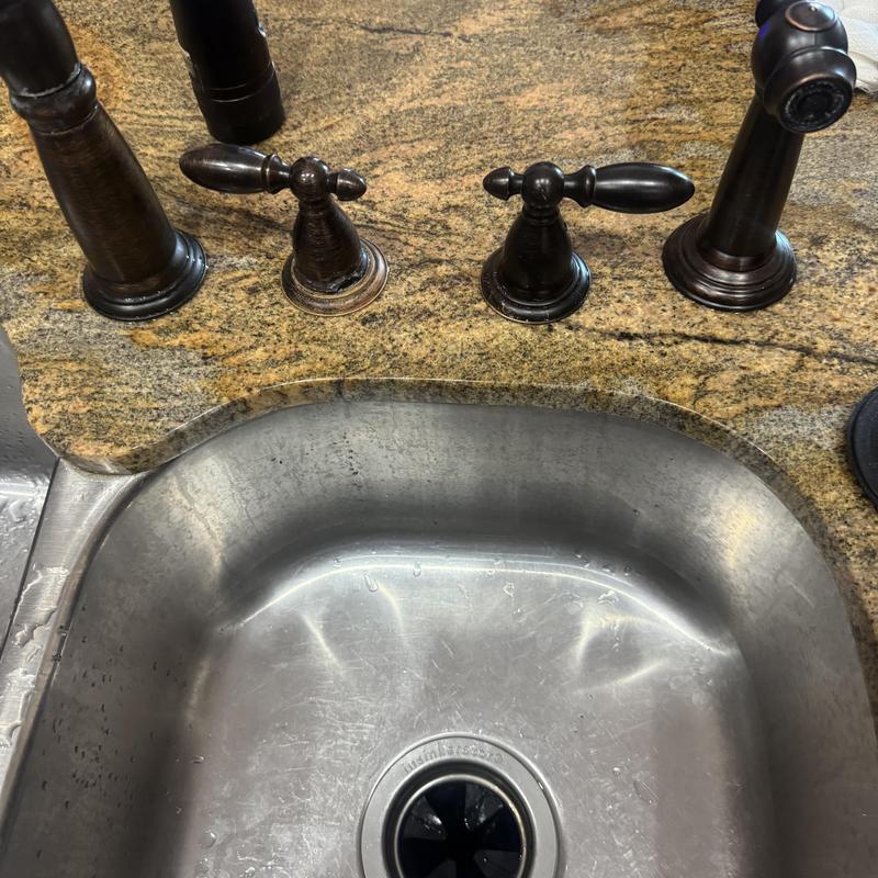 Delta bathroom faucet with oil-rubbed bronze handles