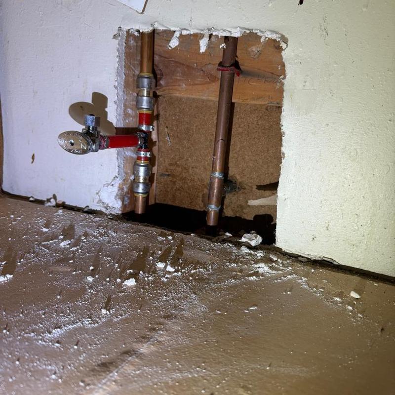 PEX piping installation with shutoff valve in wall cavity