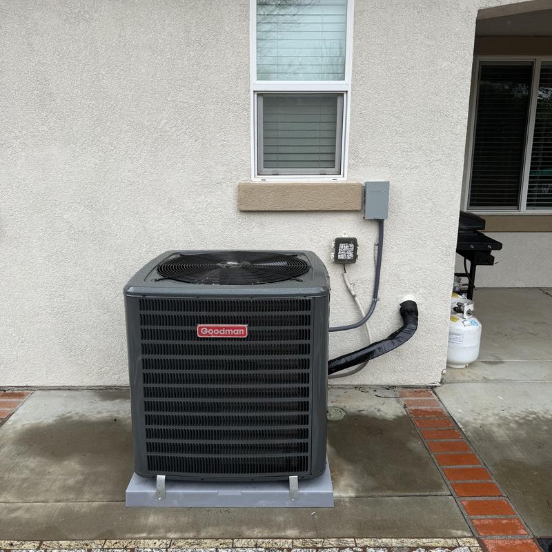 Goodman 4 ton R32 air conditioner on concrete pad Goodman 4 ton R32 air conditioner on concrete pad