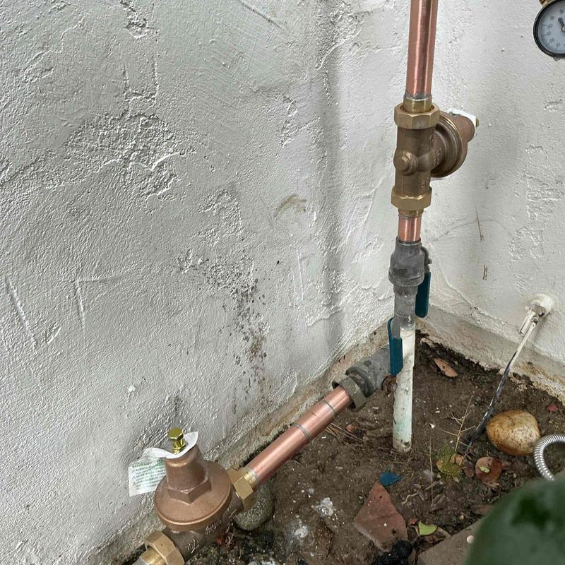 Pressure regulators on main water riser with copper piping