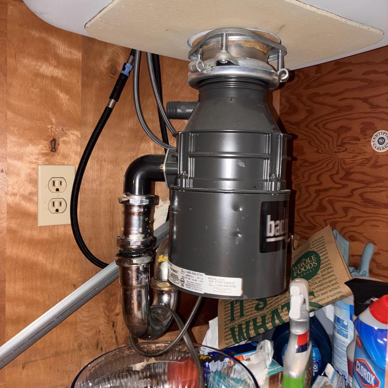 Garbage disposal with replaced P-trap and connections