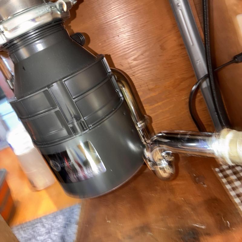 Garbage disposal and P-trap installation under sink