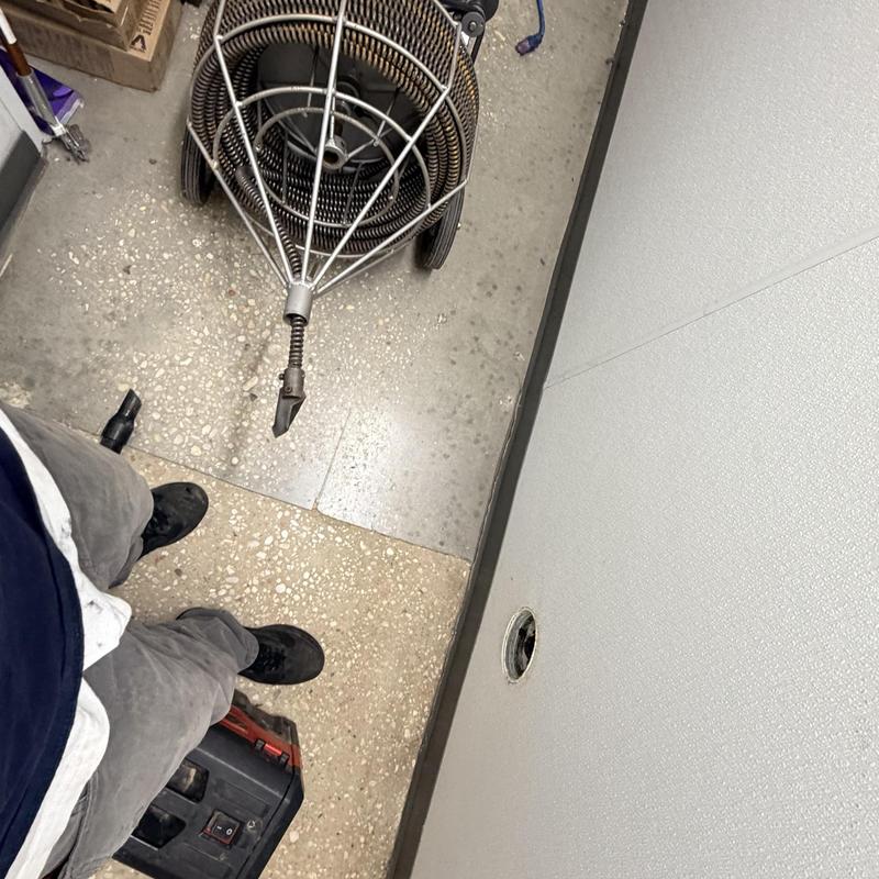 Sanitary sewer mainline cleaning with drain auger tool