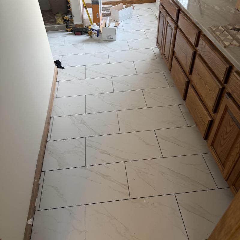 Porcelain floor tile installation in kitchen area