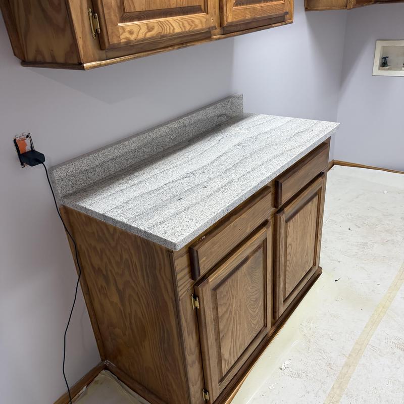 Granite countertop with wood cabinets installation