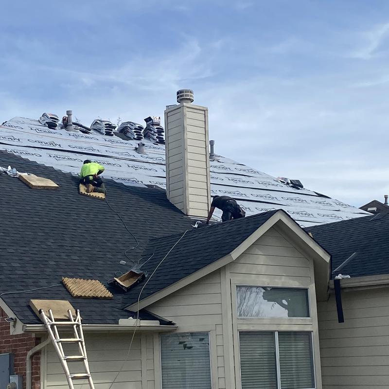 Architectural asphalt shingle roof installation in progress