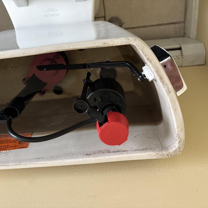 Toilet tank fill valve and float adjustment inside tank