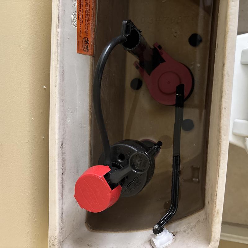 Toilet flush valve and fill valve inside tank