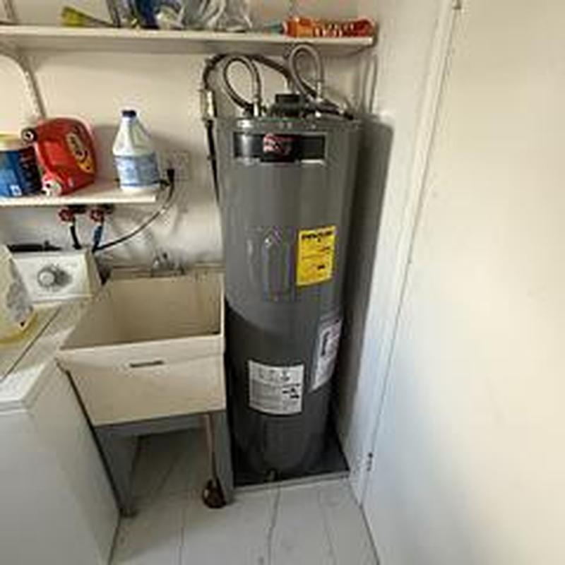 40-gallon Ruud water heater with new valves and hoses