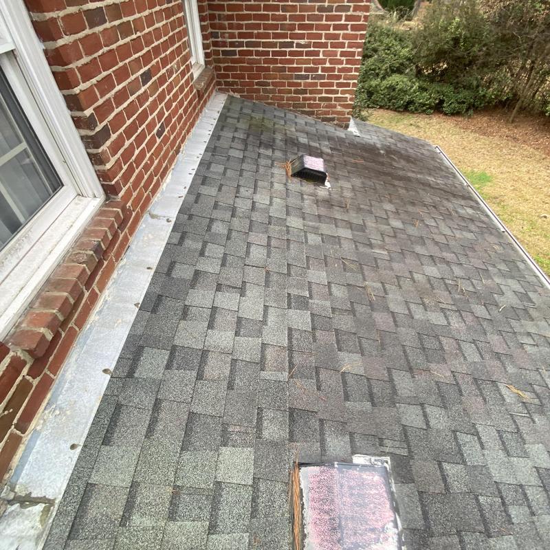 Asphalt shingle roof with vent pipe and flashing inspection