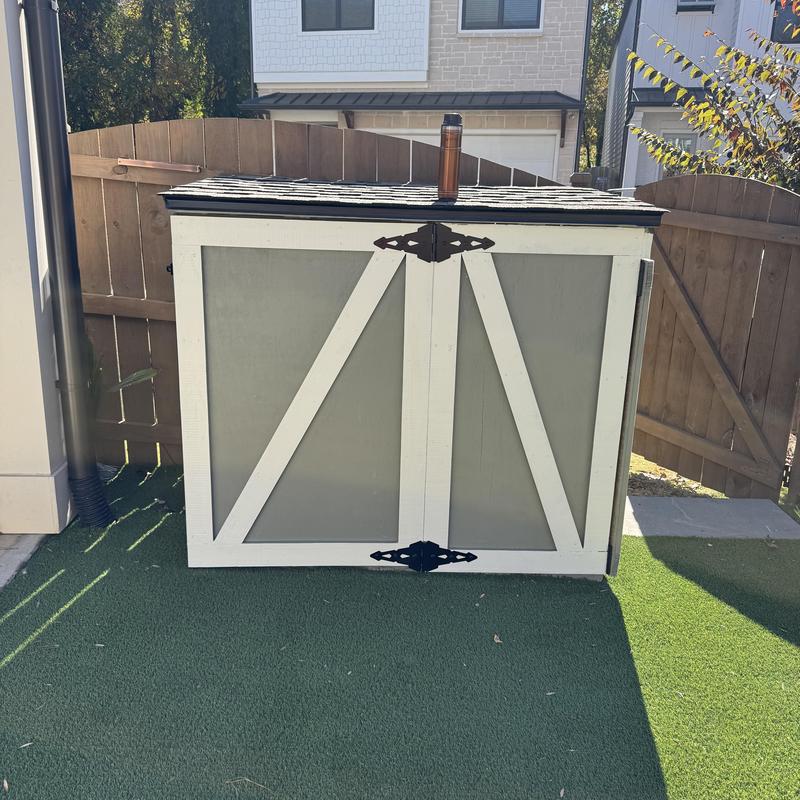 Outdoor shed with gas chimney and paver patio