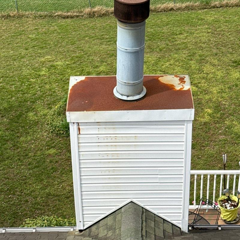 Chimney metal cap rust and vent pipe condition
