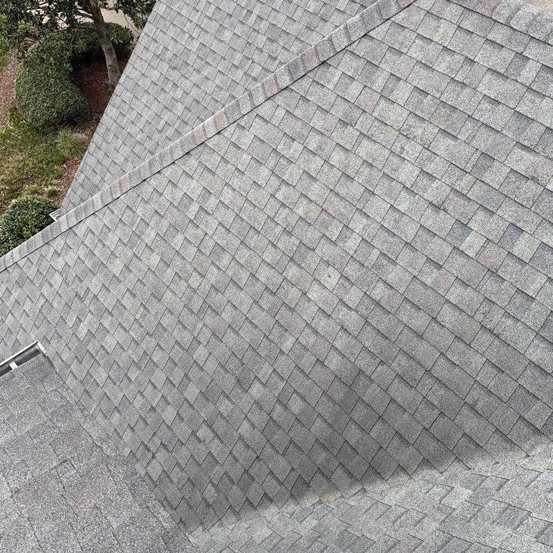 Asphalt shingle roof with hail damage inspection