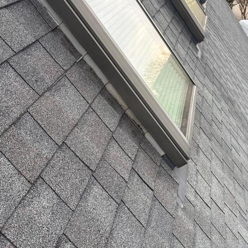 Asphalt shingle roof with window flashing and vent inspection