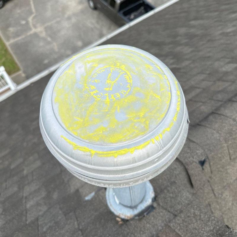 Plumbing vent cap with yellow roofing chalk marks