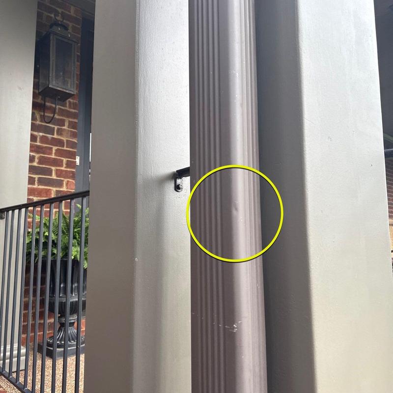 Downspout dent on exterior drainage pipe