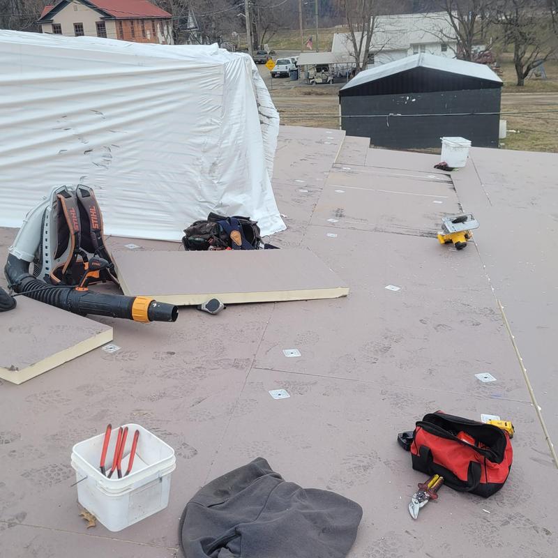 ISO board insulation panels on commercial roof deck installation