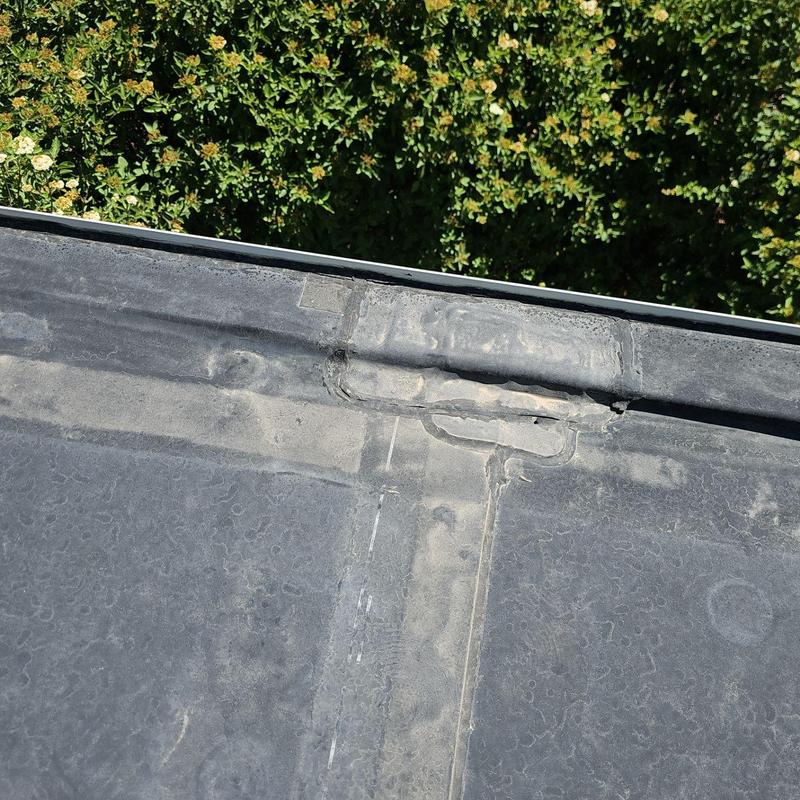 EPDM roof seam with repaired patch and sealant EPDM roof seam with repaired patch and sealant