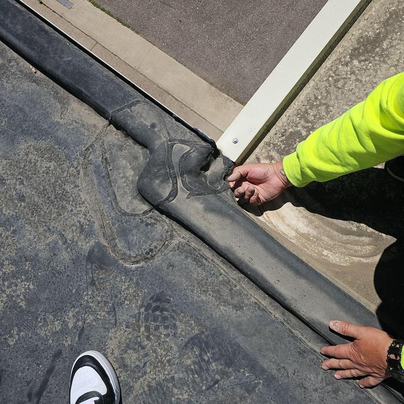 EPDM roof seam inspection and minor repairs in progress EPDM roof seam inspection and minor repairs in progress