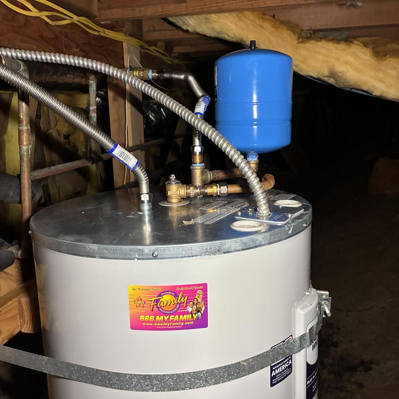 Water heater with blue expansion tank and flex lines