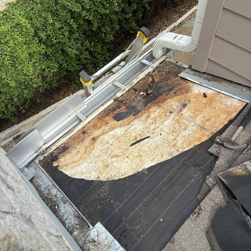 Porch roof decking with water damage and removed shingles