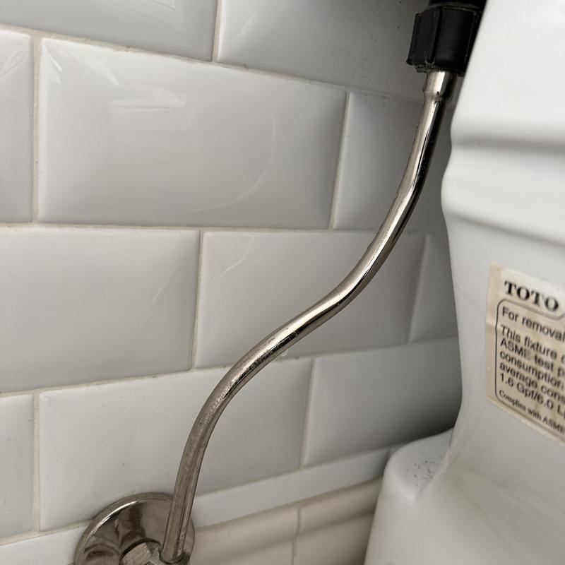 Toilet water supply line with shutoff valve installed