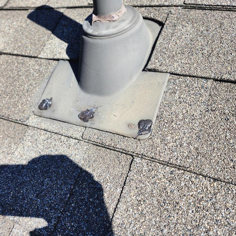 Roof vent flashing with sealed exposed fasteners