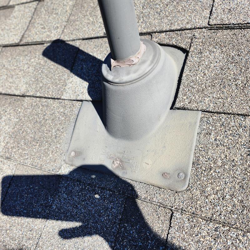 Roof pipe flashing with caulk on fasteners