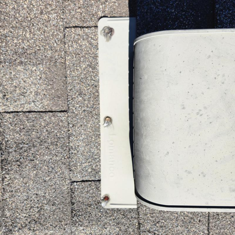 Roof membrane fasteners caulked and painted Weatherwood color